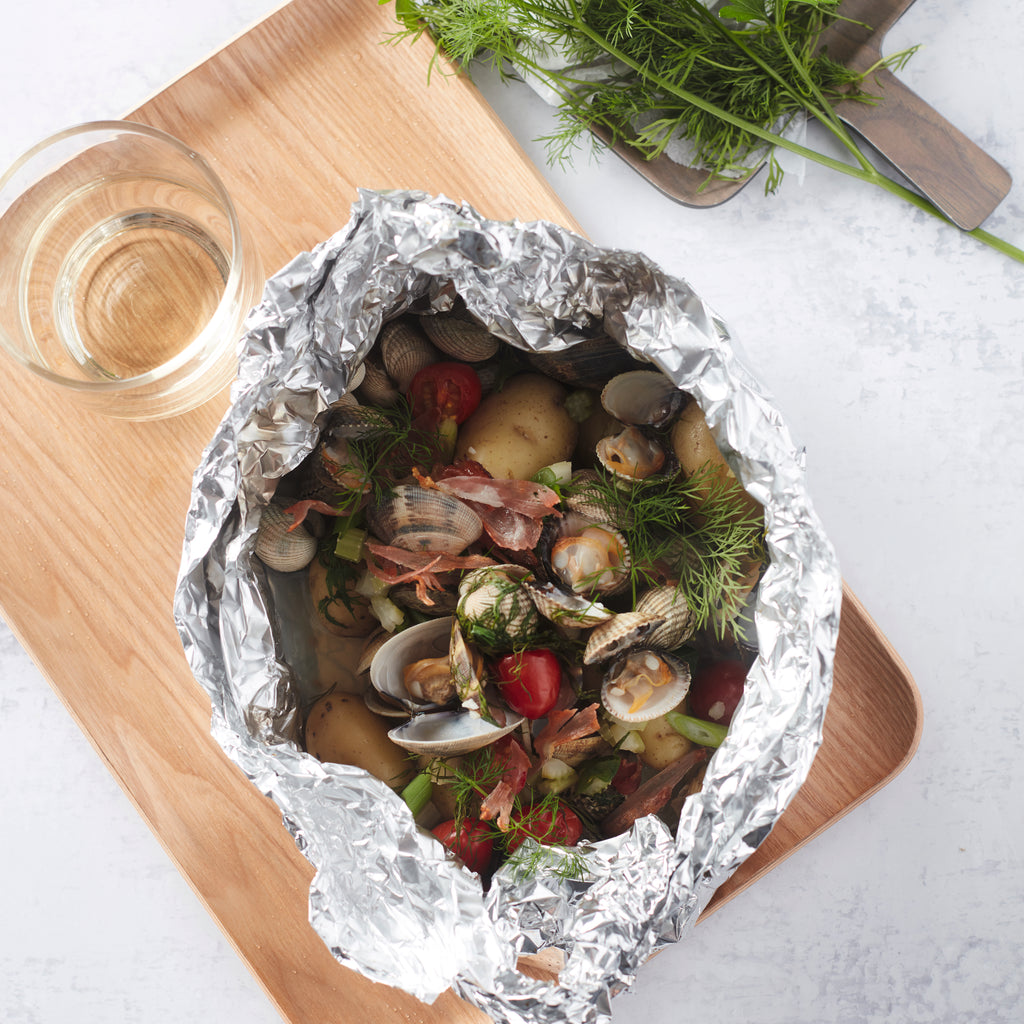 Muschelpapillote mit geräuchertem Schinken