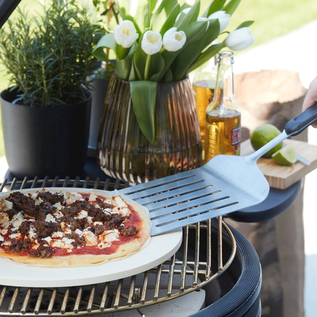 Turkish pizza with minced lamb and feta cheese on the BBQ